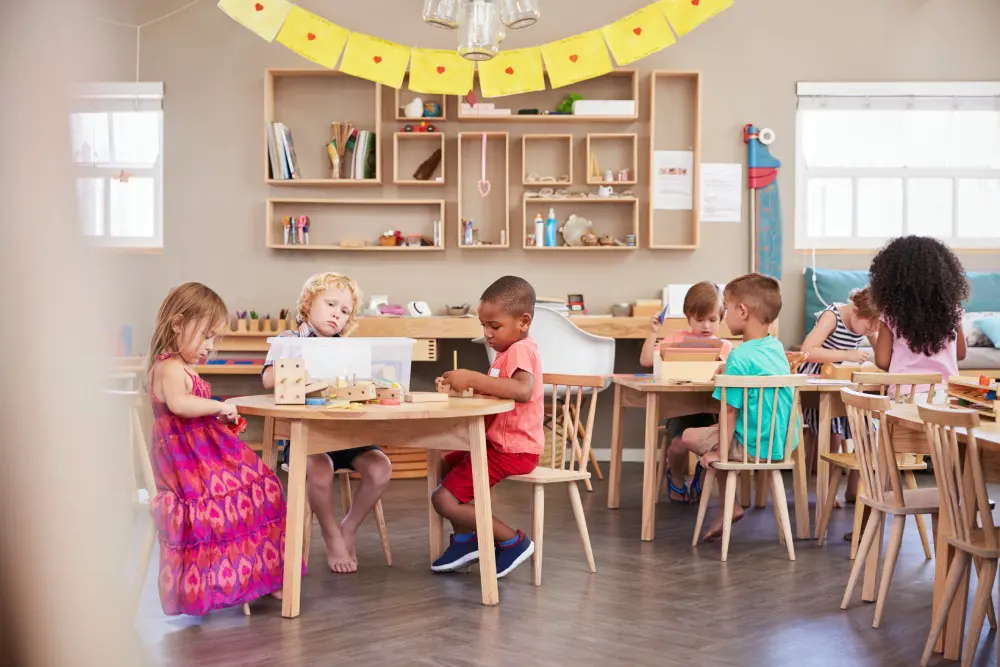 Children playing in a classroom setting.